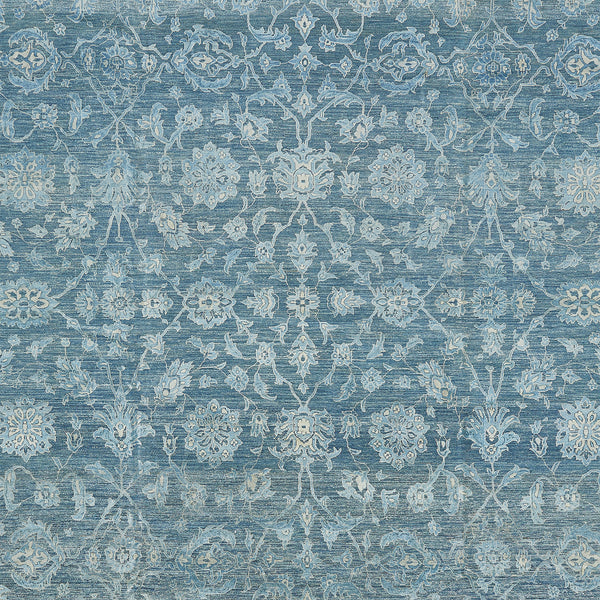 Intricate blue and white textile with vintage ornamental floral pattern.