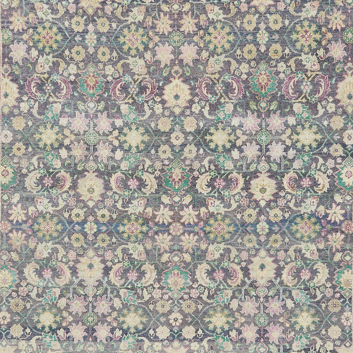 Intricate vintage floral fabric with muted colors and symmetrical layout.