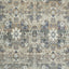 Detailed view of a traditional floral patterned fabric or carpet.