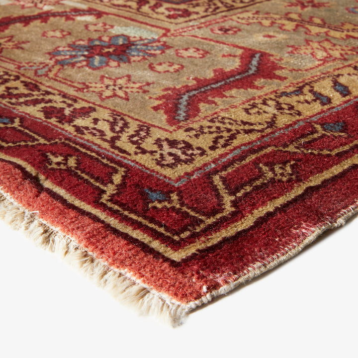 Close-up of an ornate, handmade rug showcasing rich colors and intricate patterns.