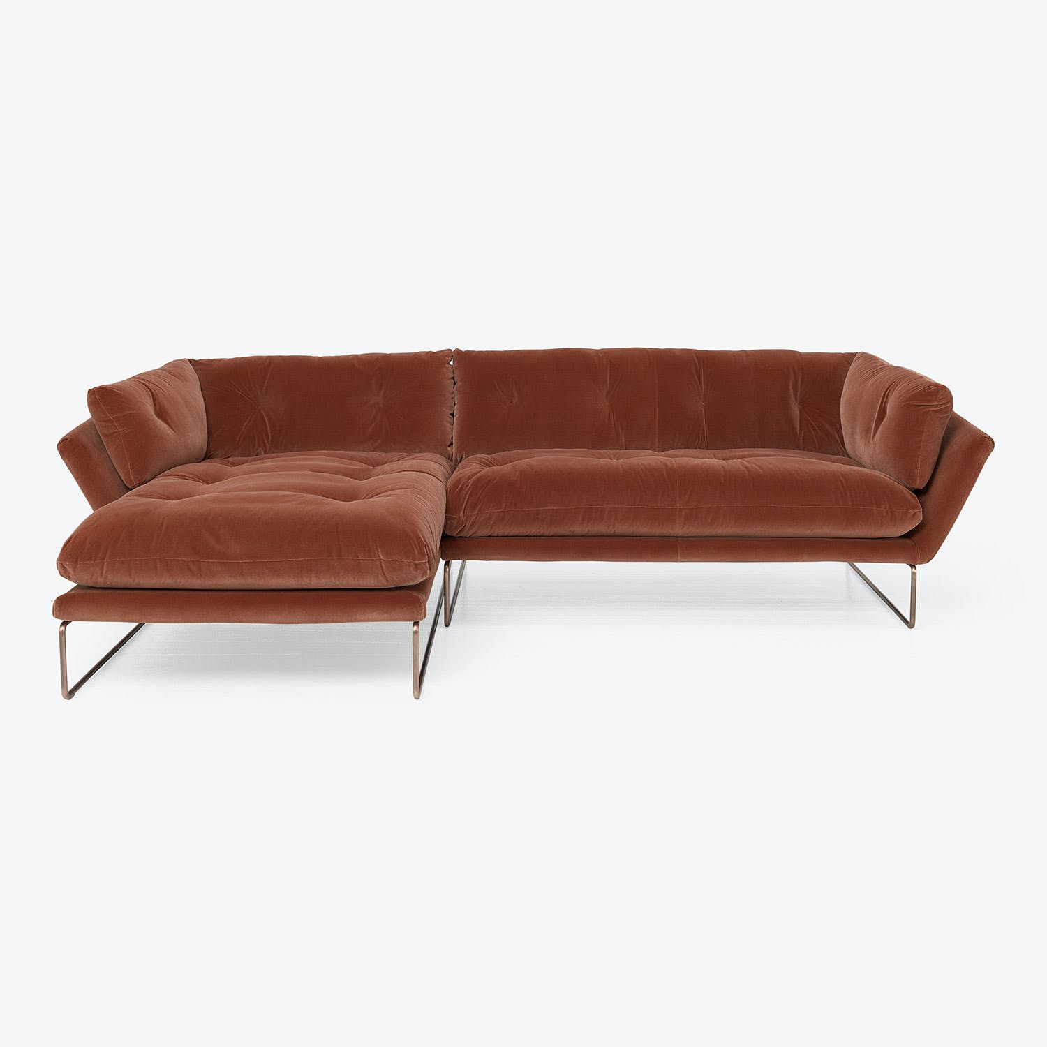 Modern corner sectional sofa with luxurious velvet upholstery in brown.