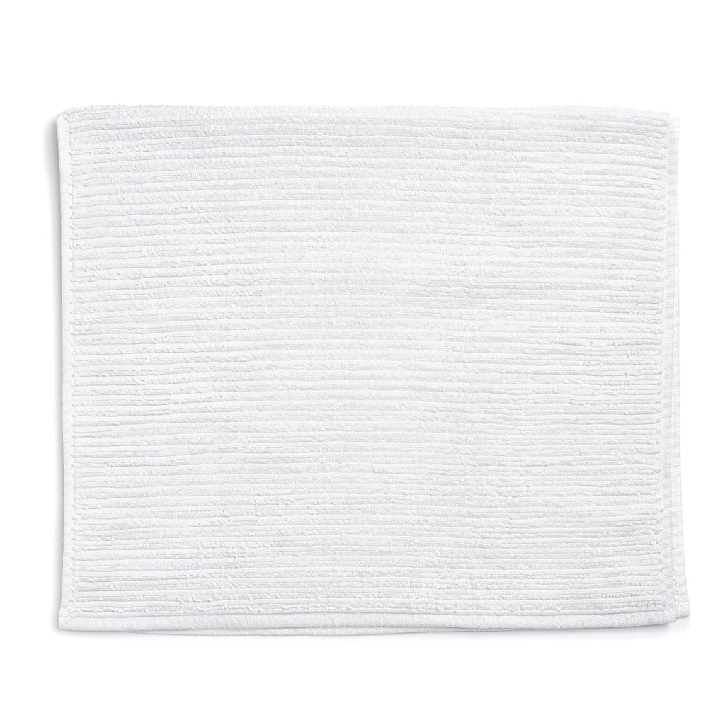 Crinkled white terrycloth towel neatly folded against a white background.