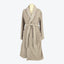 Beige terry cloth bathrobe with shawl collar and patch pockets.