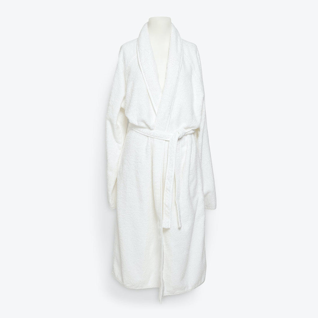 Plush white bathrobe with shawl collar and matching belt displayed.