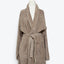 Taupe-colored bathrobe with shawl collar and plush terry cloth fabric.