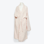Cozy and stylish, a pale pink bathrobe for ultimate relaxation.