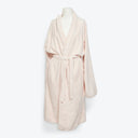 Cozy and stylish, a pale pink bathrobe for ultimate relaxation.