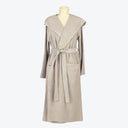Beige bathrobe with shawl collar and patch pockets on mannequin.