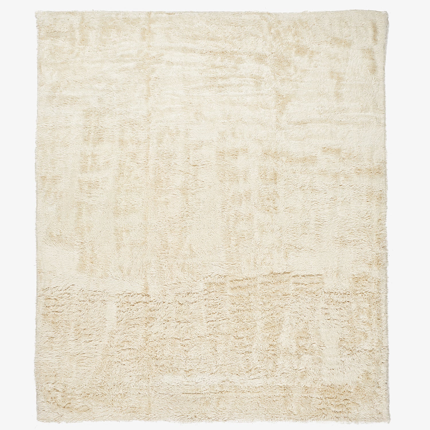Rectangular cream rug with plush texture and subtle wear marks.