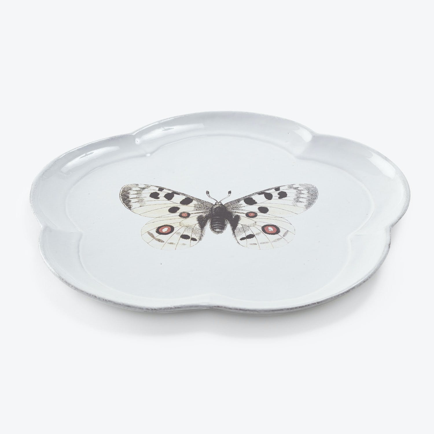 Elegant ceramic plate features a stunning butterfly motif in detailed design.