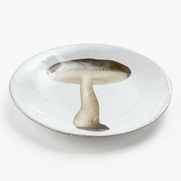 Handmade, textured white plate with a stylized mushroom design.