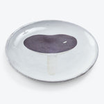 Handcrafted ceramic plate featuring a minimalist mushroom illustration design.