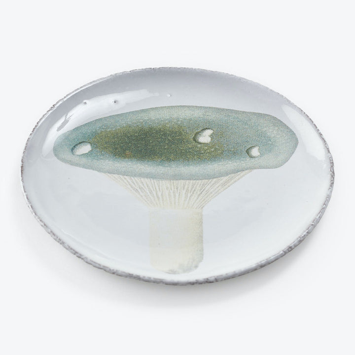 Realistically rendered mushroom design on handcrafted rustic plate.