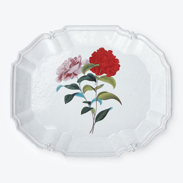 An intricately designed octagonal plate adorned with a floral illustration.