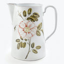 Elegant white pitcher with floral design, perfect for vintage decor.