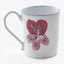 Vintage white enamel mug adorned with a vibrant red flower.