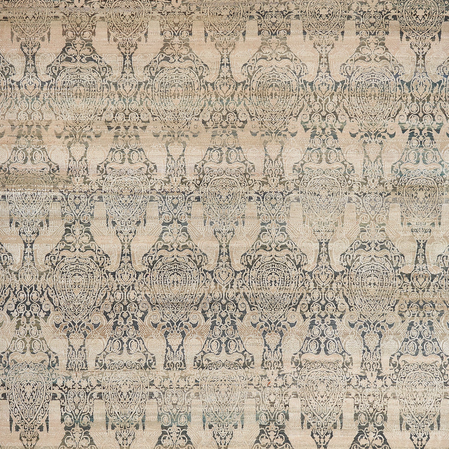 Intricate symmetrical patterned fabric with classical motifs in neutral tones.