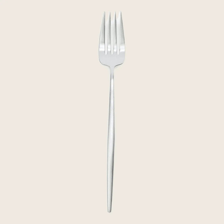 Minimalist stainless steel fork against a plain white background.