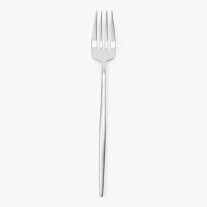 Minimalist stainless steel fork against a plain white background.