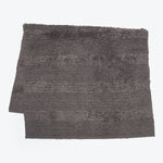 Soft and absorbent grey bath mat with plush shaggy surface