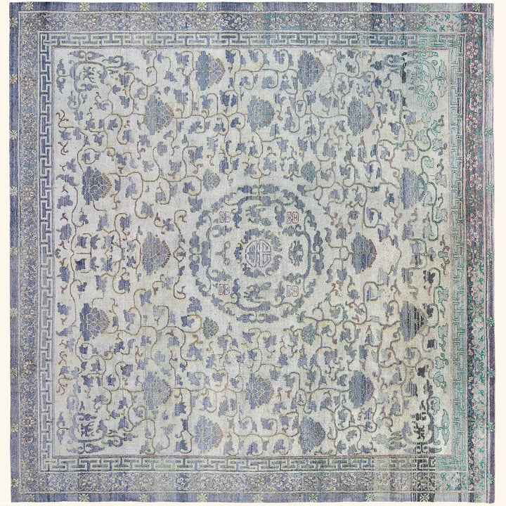An intricately designed vintage rug with muted colors and symmetrical patterns.