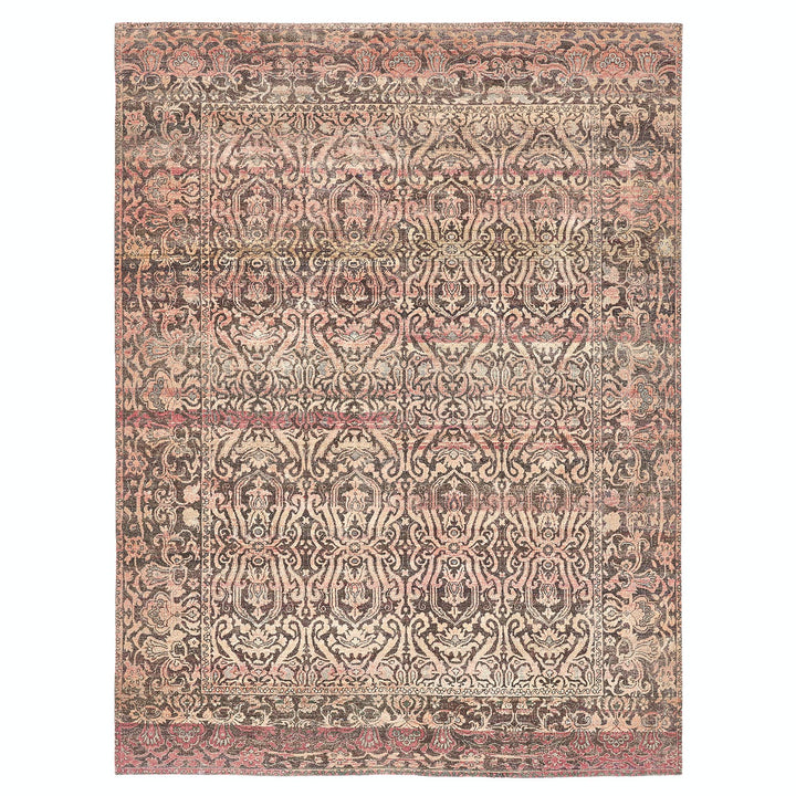 Intricate and symmetrical rug with ornate patterns in pink, cream, and charcoal.