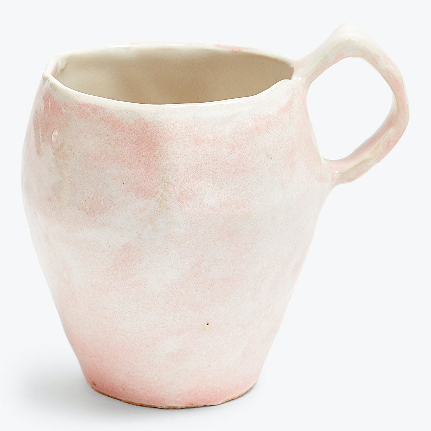 Handcrafted ceramic pitcher in light pink and white marbled design.