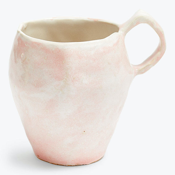 Handcrafted ceramic pitcher in light pink and white marbled design.