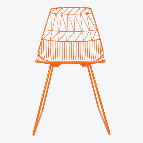 Vibrant orange wire-frame chair with minimalist geometric design.