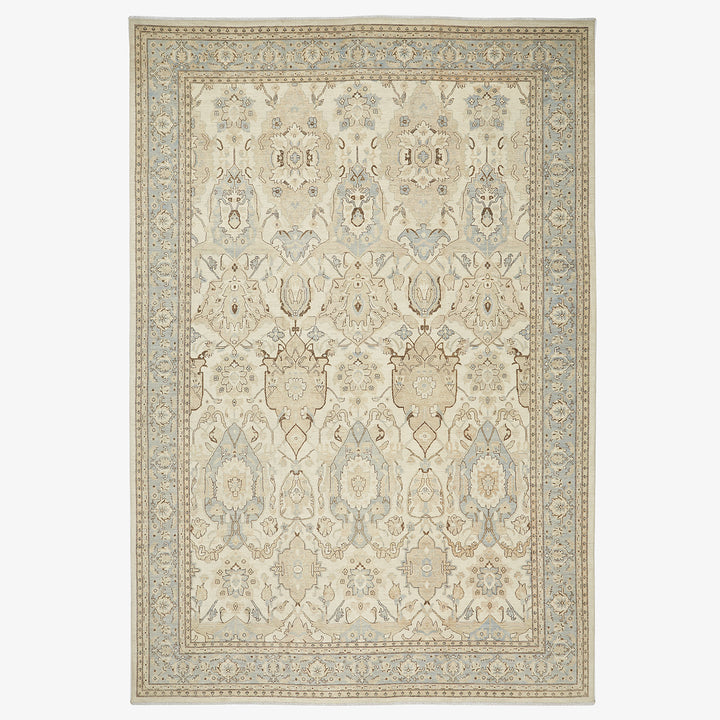 Exquisite handwoven rug with intricate floral and geometric patterns.