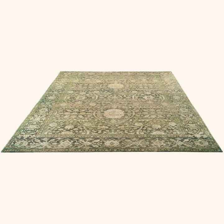 Intricate vintage rectangular rug with symmetrical traditional design and muted colors.