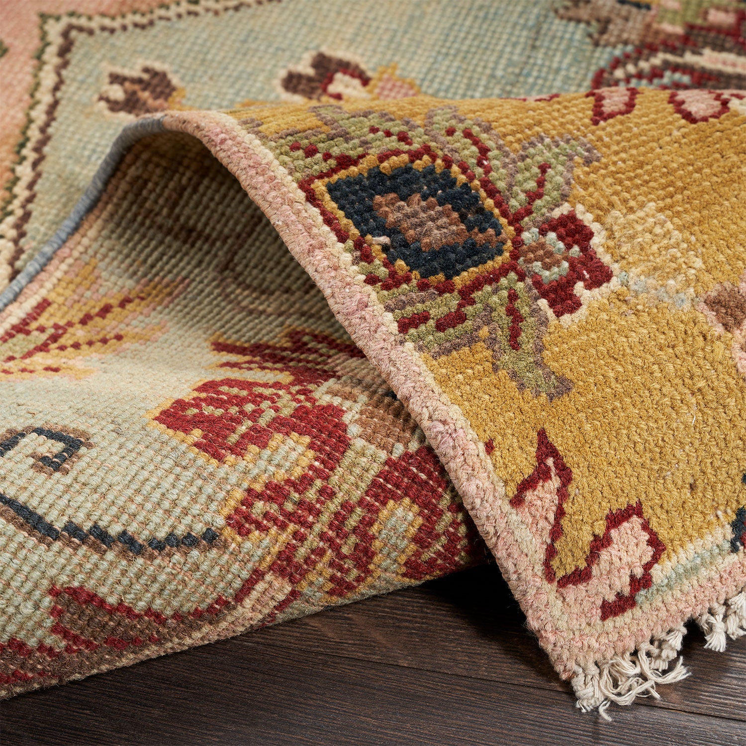 Traditional patterned rug with intricate design and artisanal craftsmanship.