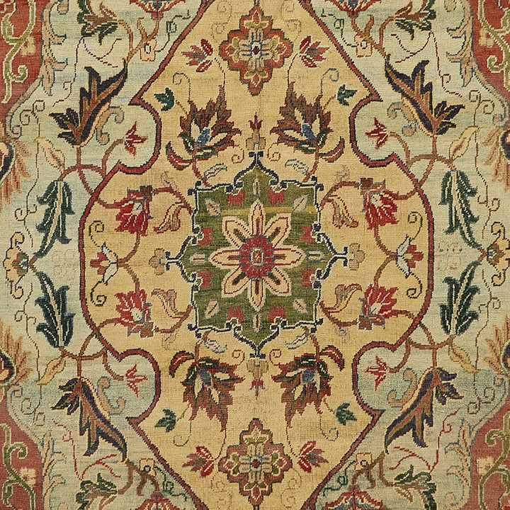 Exquisite traditional-style carpet showcases intricate floral motifs and meticulous craftsmanship.