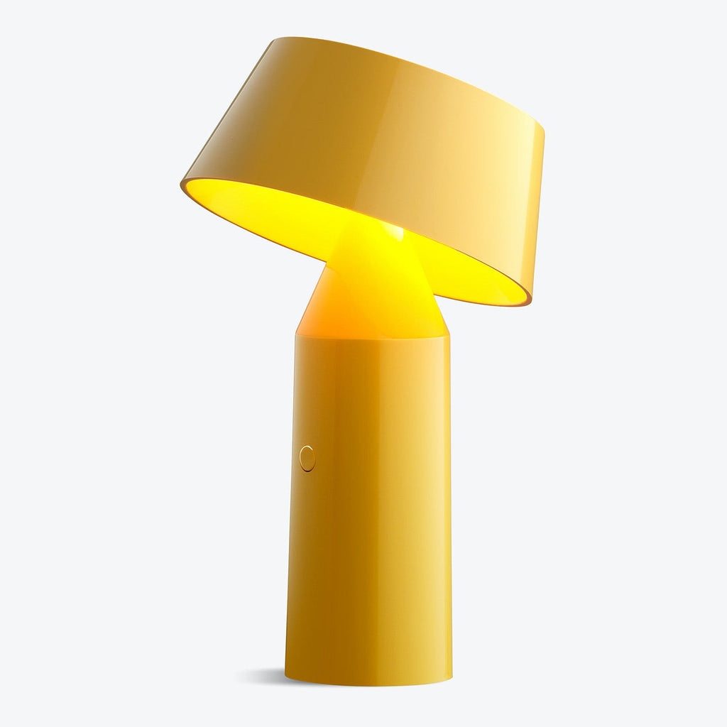 Modern yellow table lamp with sleek design and glossy finish.