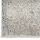 Modern distressed rug with abstract pattern and subtle beige accents.