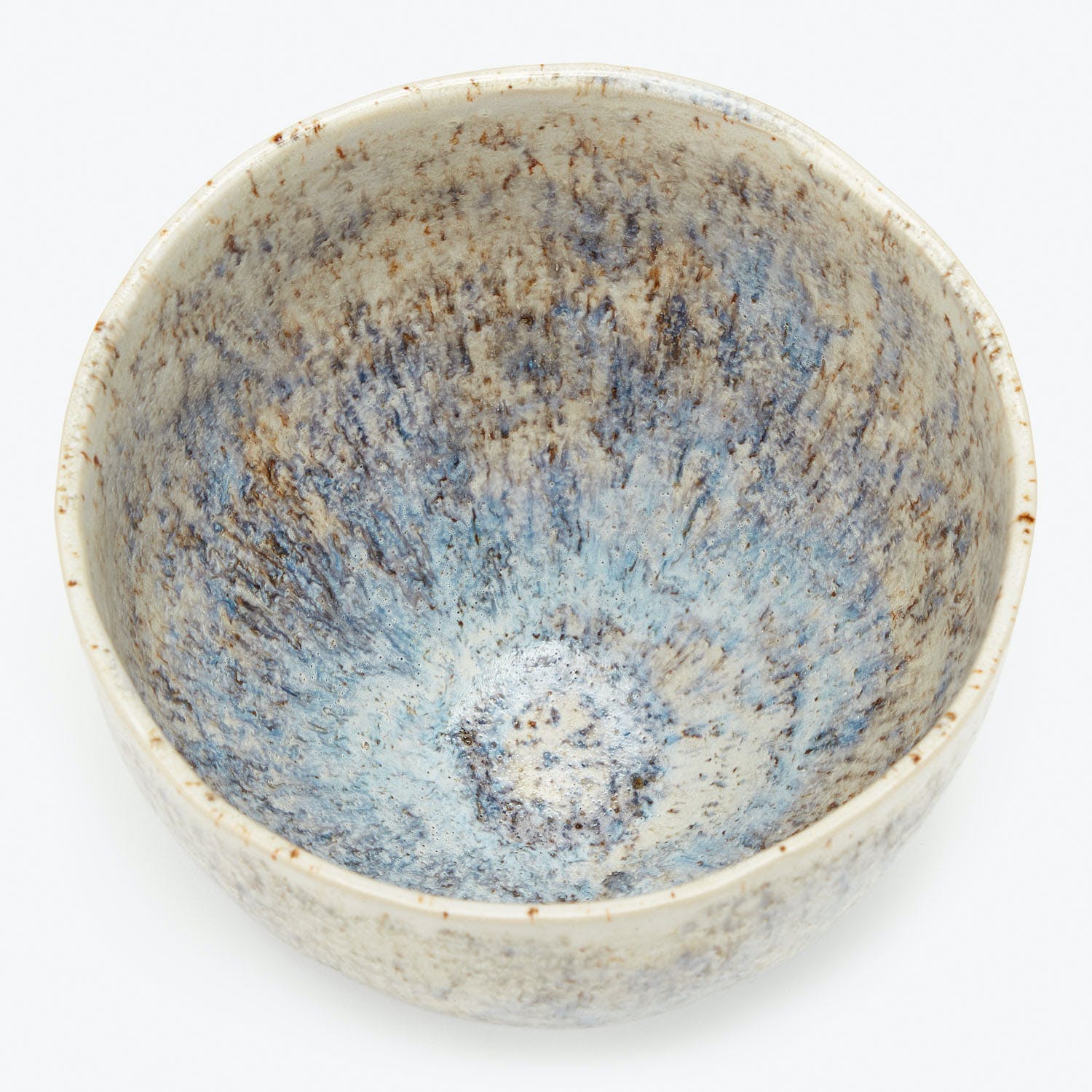 Handcrafted ceramic bowl with unique glaze showcases beautiful color blending