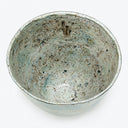 Handcrafted ceramic bowl with mottled blue, gray, and brown speckles