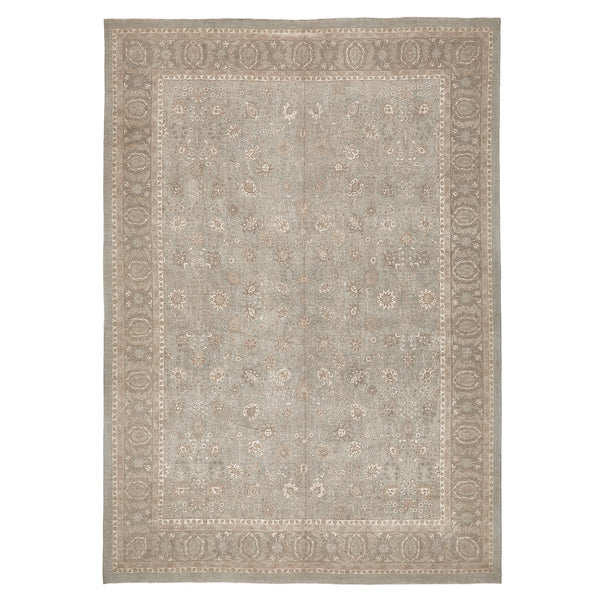 Antique-inspired rectangular rug with neutral tones and intricate floral design.