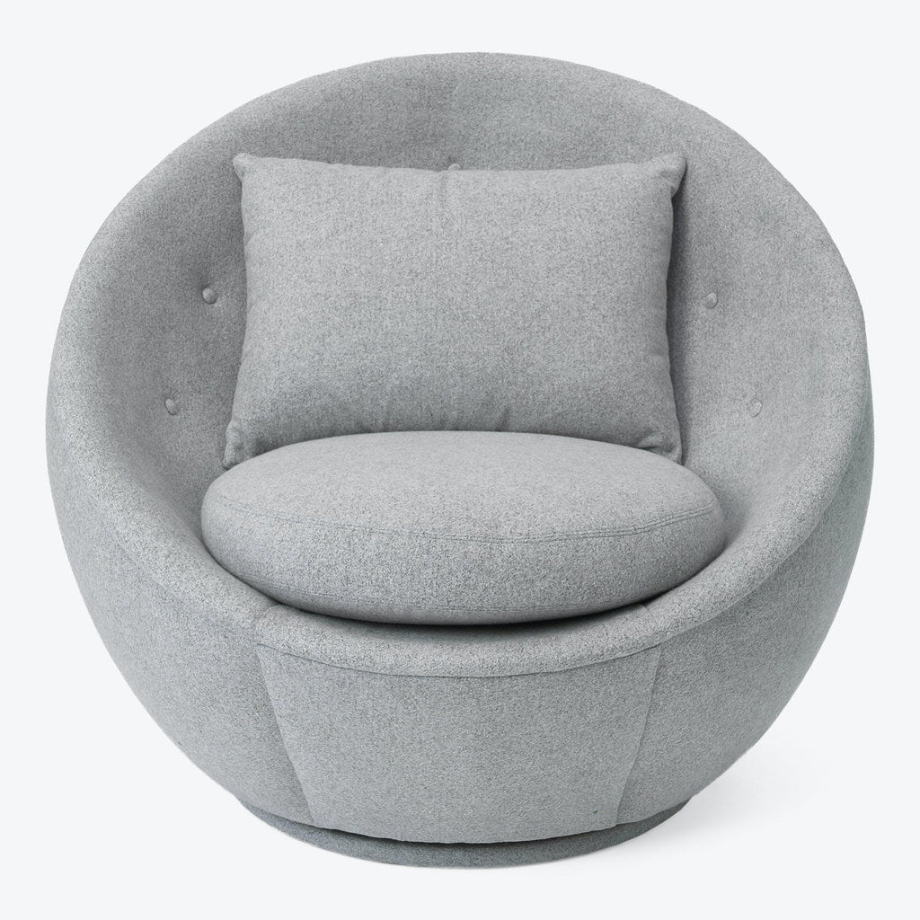 Contemporary round chair with plush design, perfect for comfortable seating.