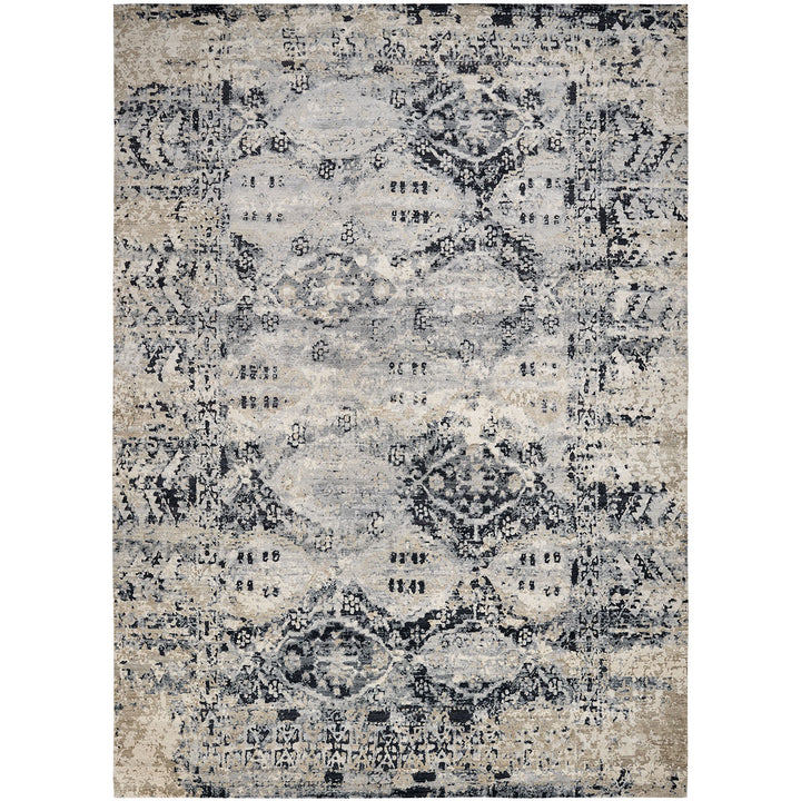 Rectangular area rug with distressed, faded design in grey and beige.