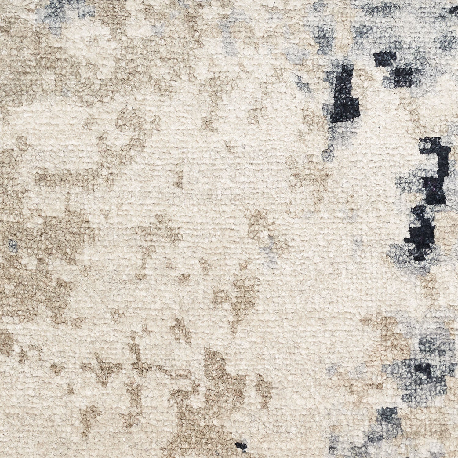 Close-up view of a textured beige rug with abstract dark spots.