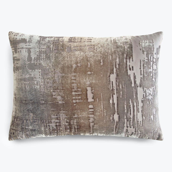 Rectangular throw pillow with abstract distressed design in shades of gray and silver.