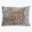 Rectangular throw pillow with abstract distressed design in shades of gray and silver.