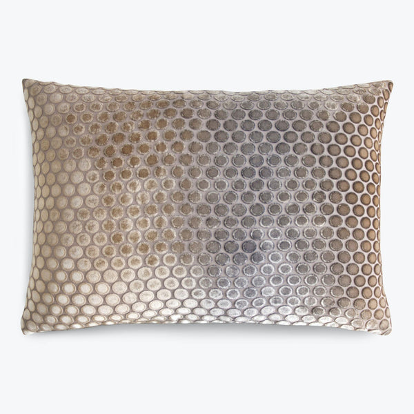 Decorative pillow with gradient circular patterns in velvety texture.