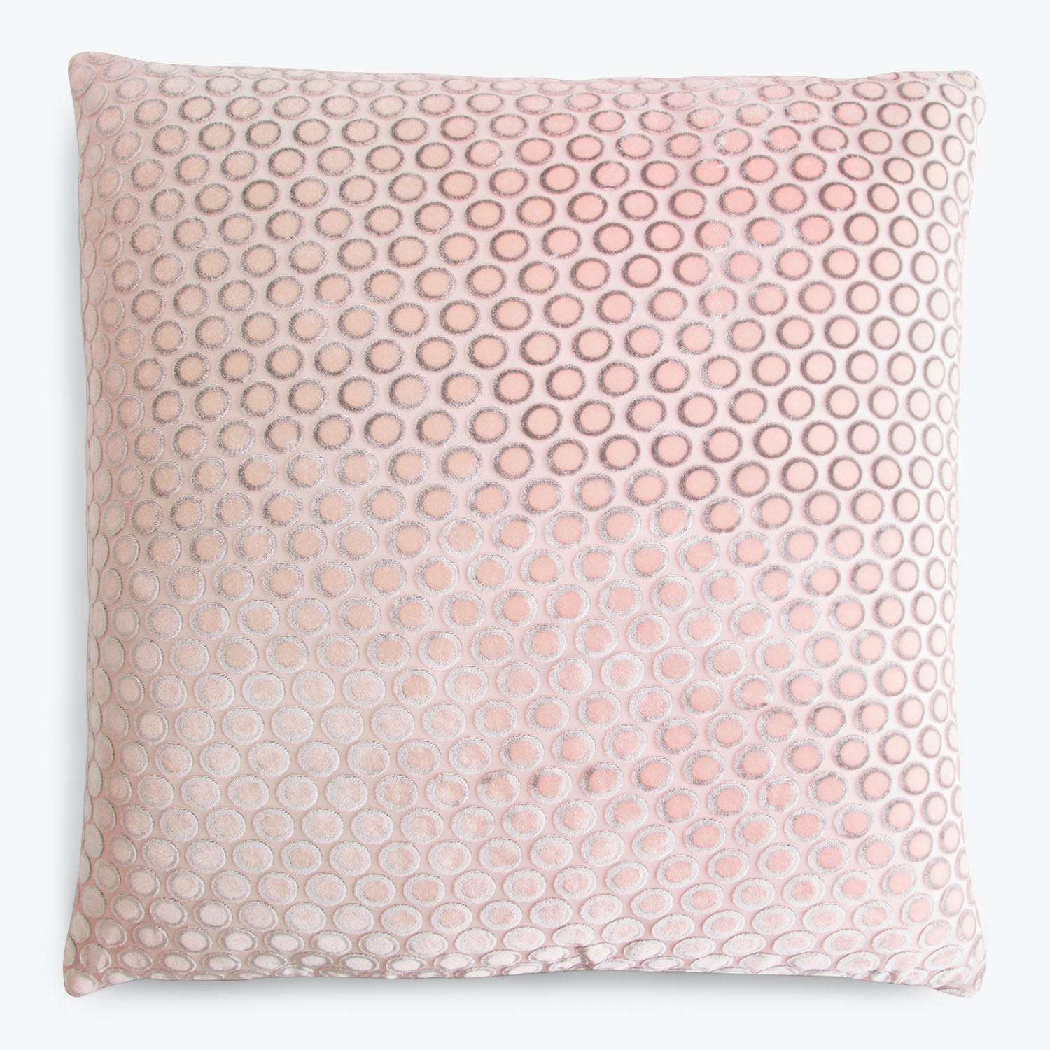 Square pillow with geometric design in shades of pink