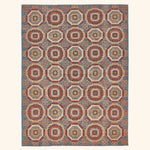 Exquisite Oriental rug showcases intricate geometric patterns in harmonious colors.