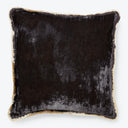 Black square pillow with plush velvet texture and gold fringe.