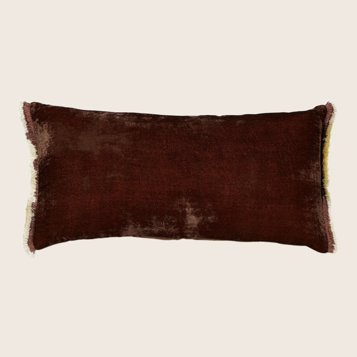 Plush, velvety rectangular pillow in rich dark brown with light trim