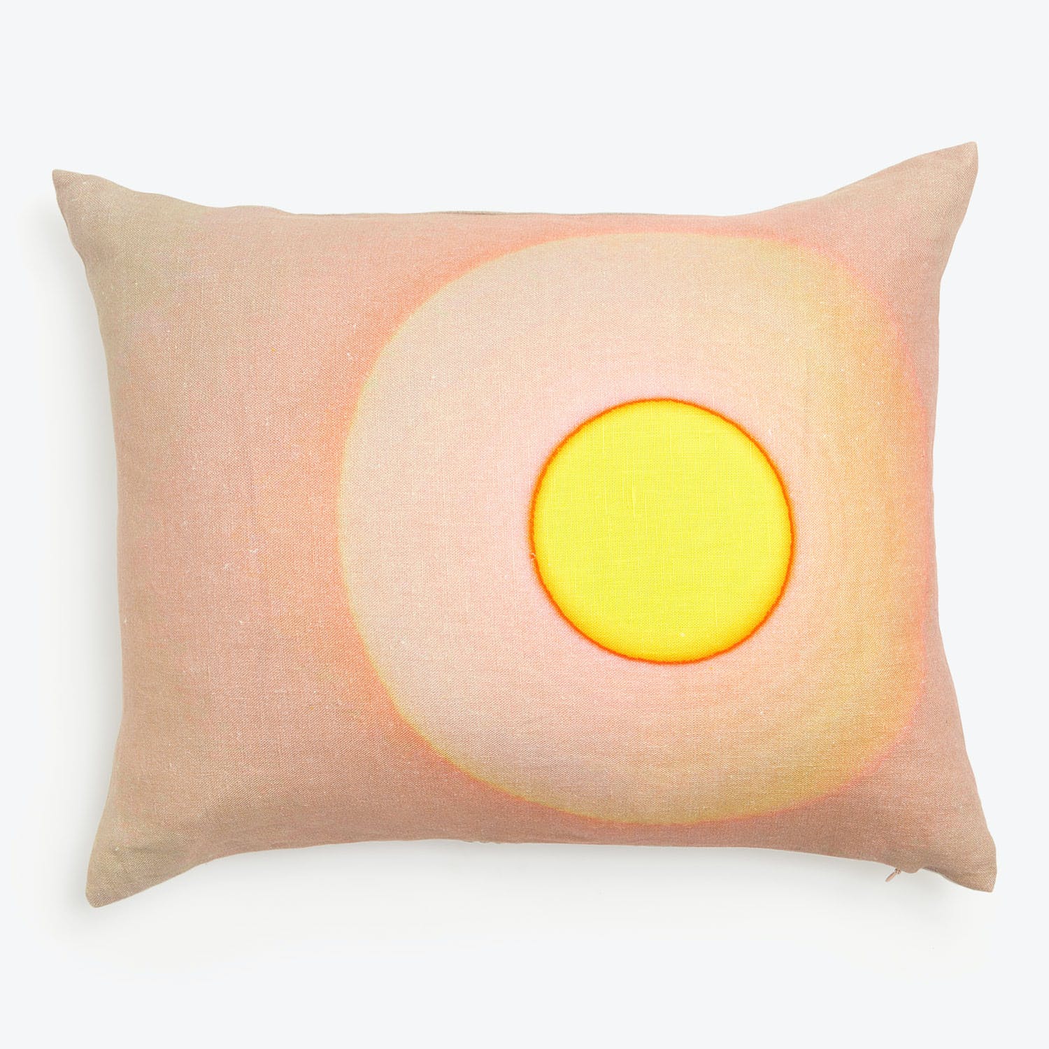 Rectangular pillow with fried egg design on light beige fabric.