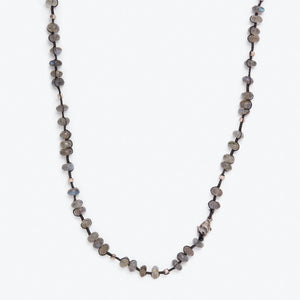 Close-up of a multicolored stone bead necklace, perfect for adornment. - hover